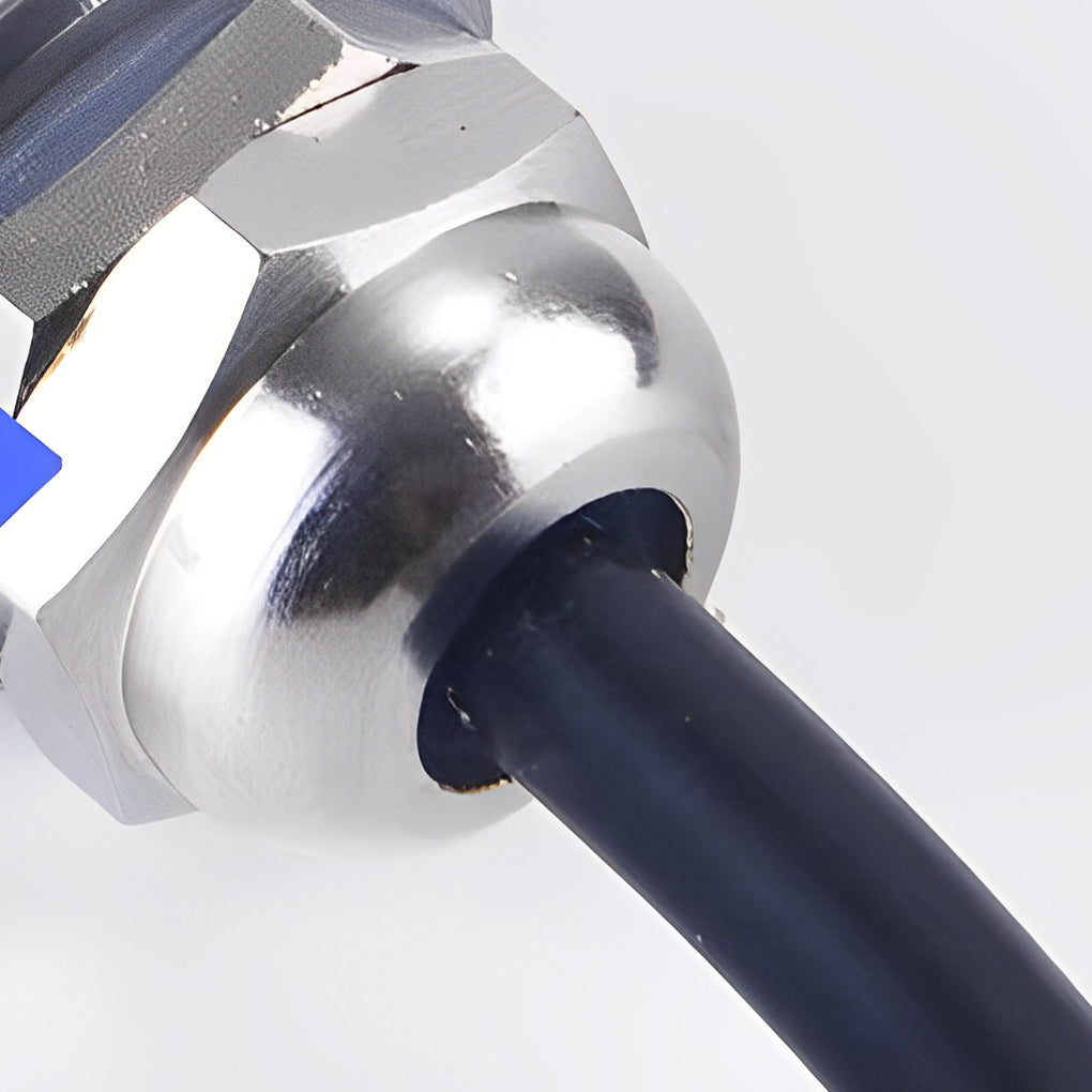 Outdoor step light fixtures illuminating a waterfront walkway with vibrant colors at night.