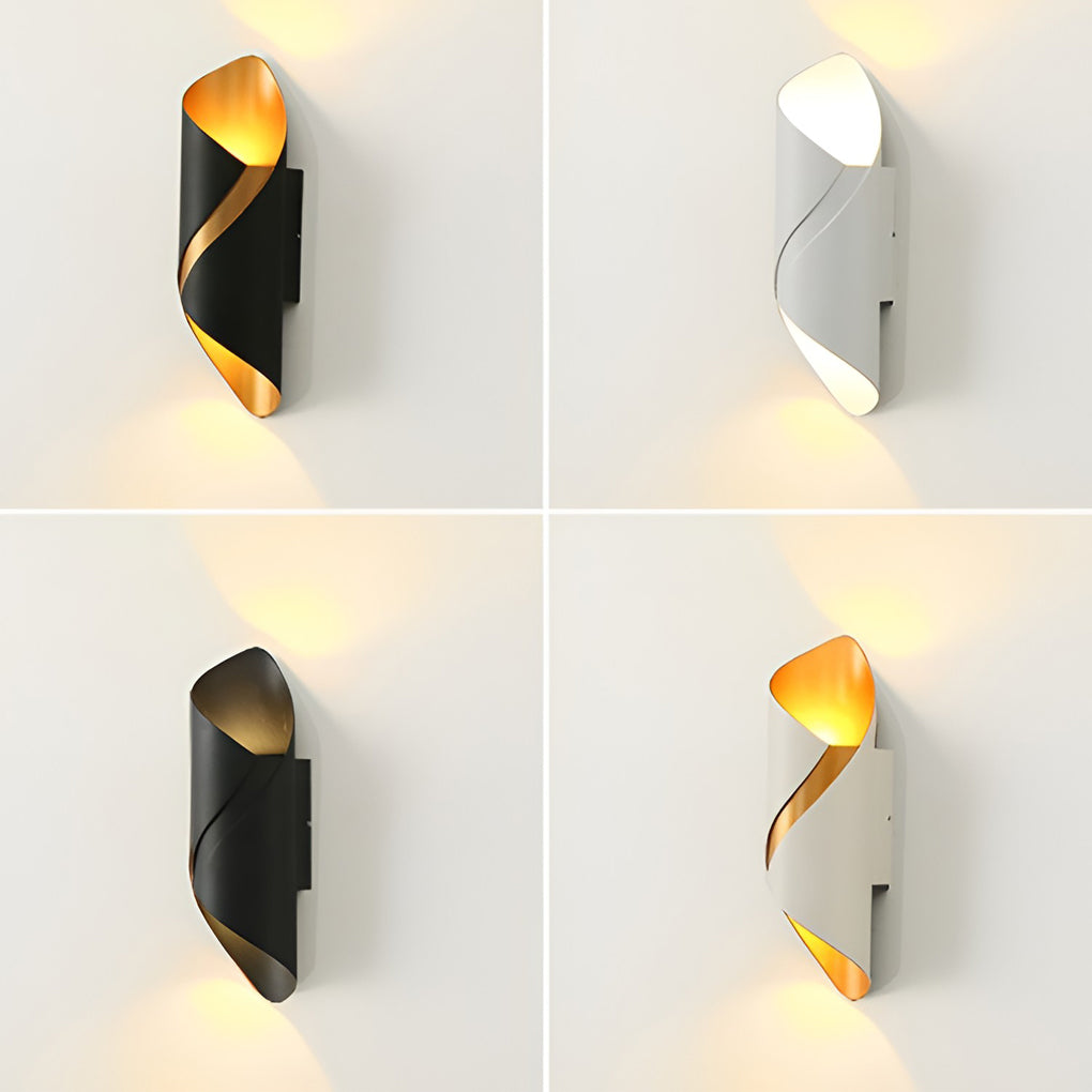 Outdoor up down wall light with black finish, installed on white wall in hallway.