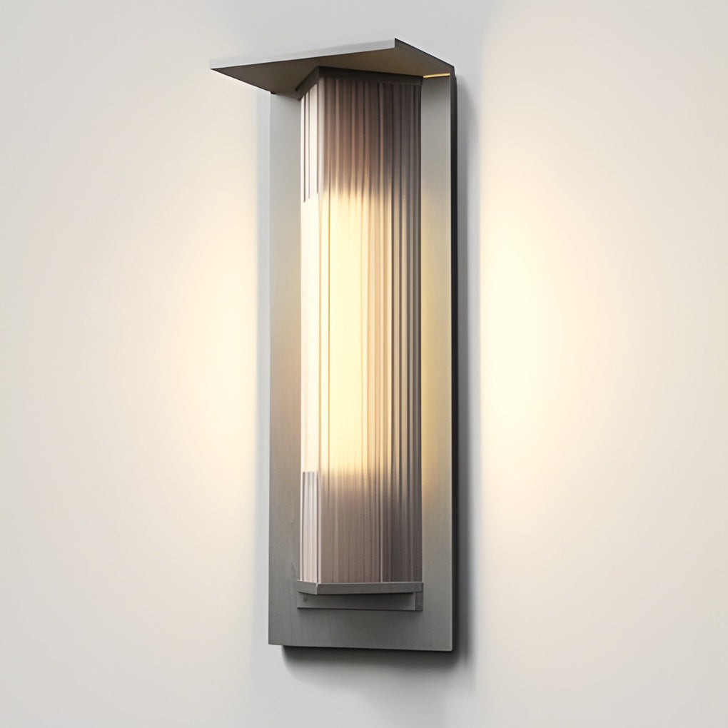 Outdoor vertical wall sconce with close-up of its sleek design and light output.