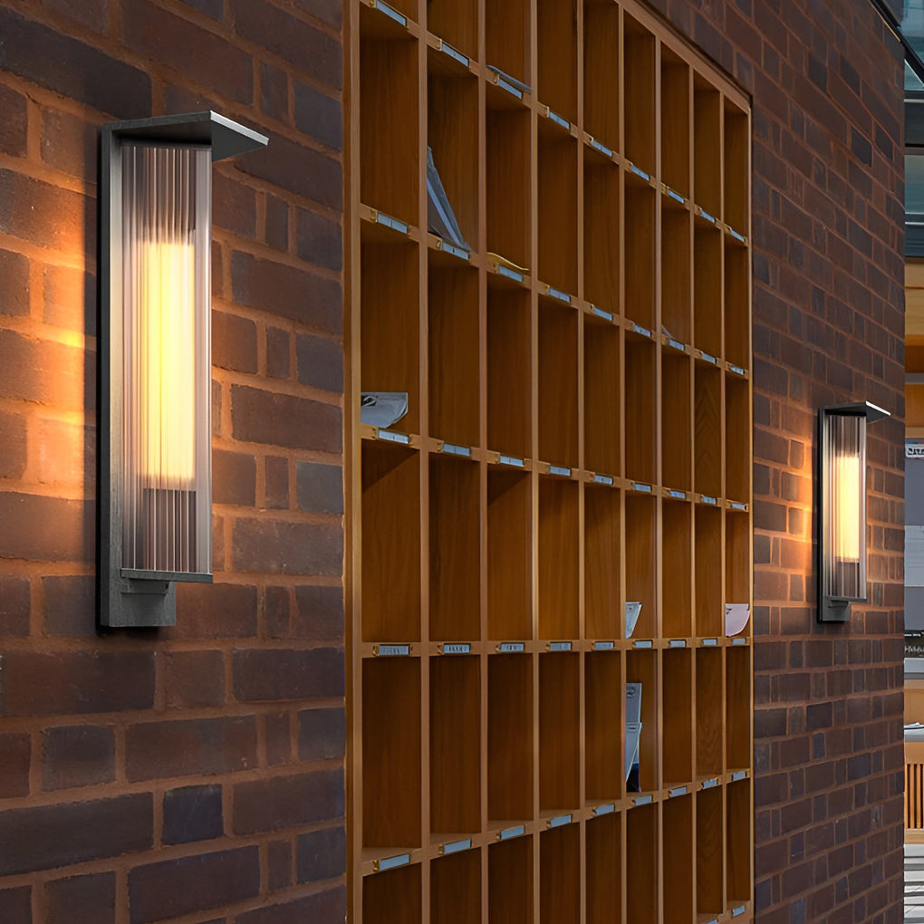 Outdoor vertical wall sconce providing elegant illumination for a contemporary garden.