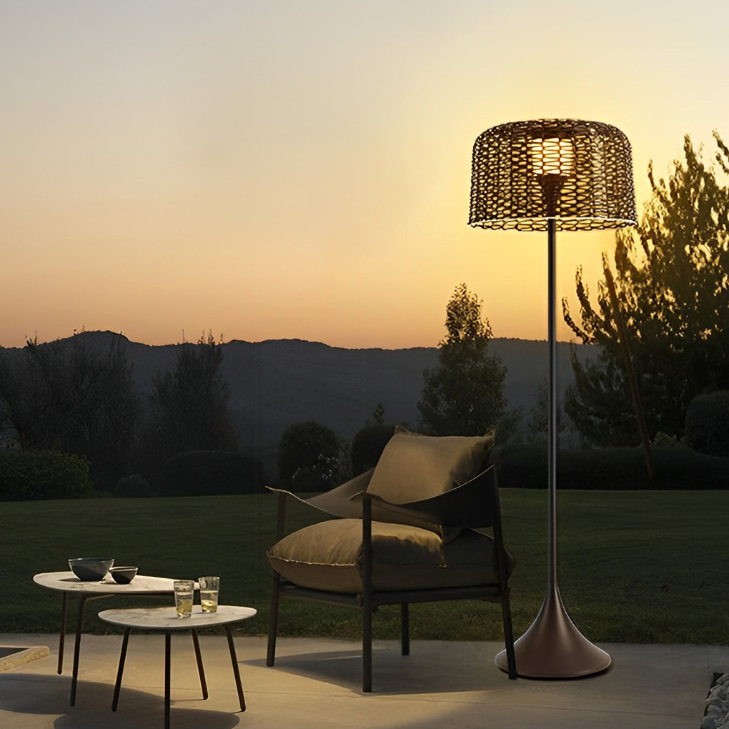 Outdoor waterproof floor lamps standing on a lawn at sunset, providing soft illumination for outdoor relaxation spaces.