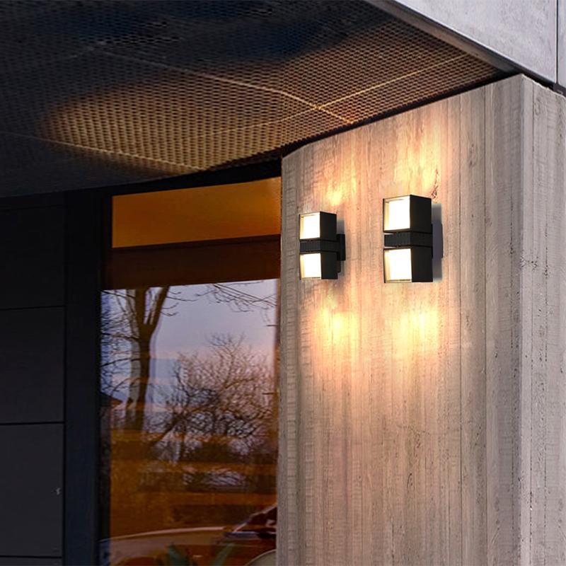 Outside up down wall lights with a sleek design, enhancing a modern exterior wall.