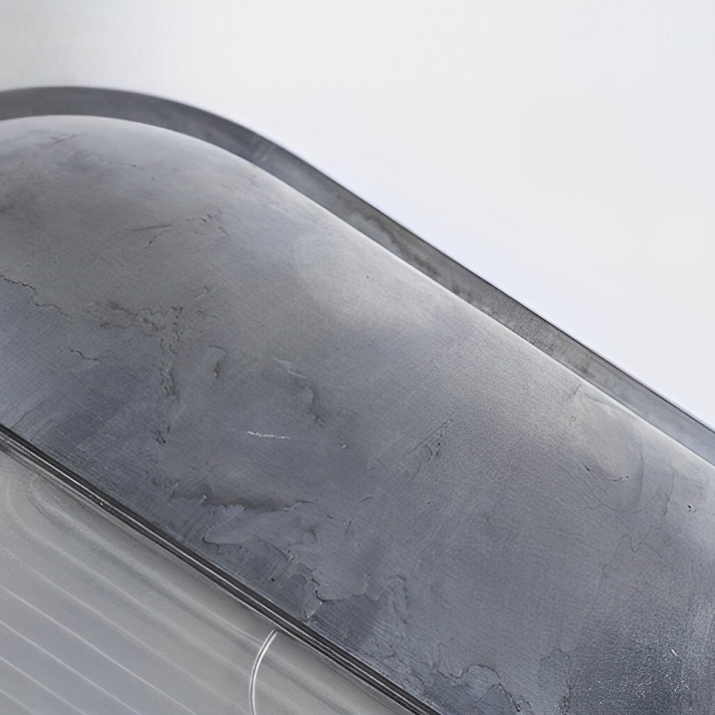 Single oval bulkhead outdoor wall light with metal frame and warm glow shown on a clean background.