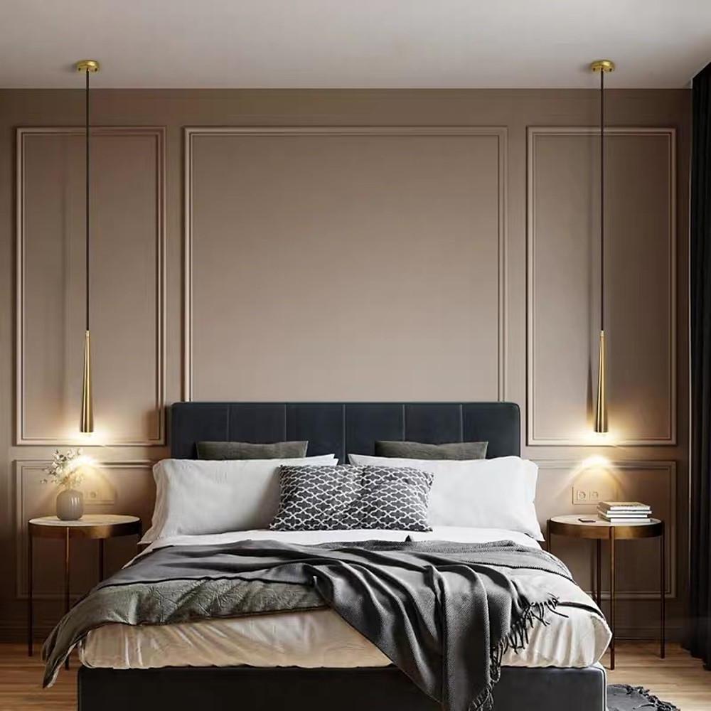 Elegant pair of Slim Gold Cone Pendant lights used as symmetrical bedside lamps for a bed.
