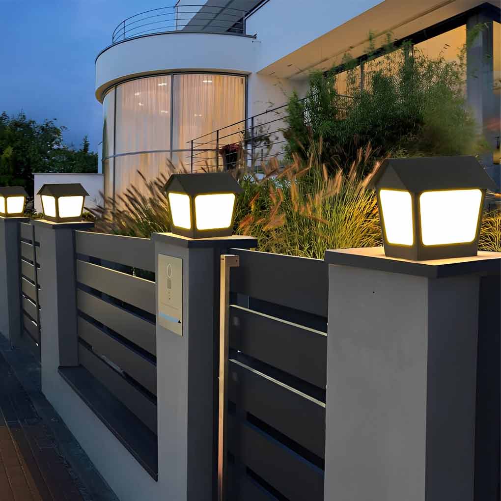 Patio pillar lights illuminating a minimalist outdoor garden with focused glow.