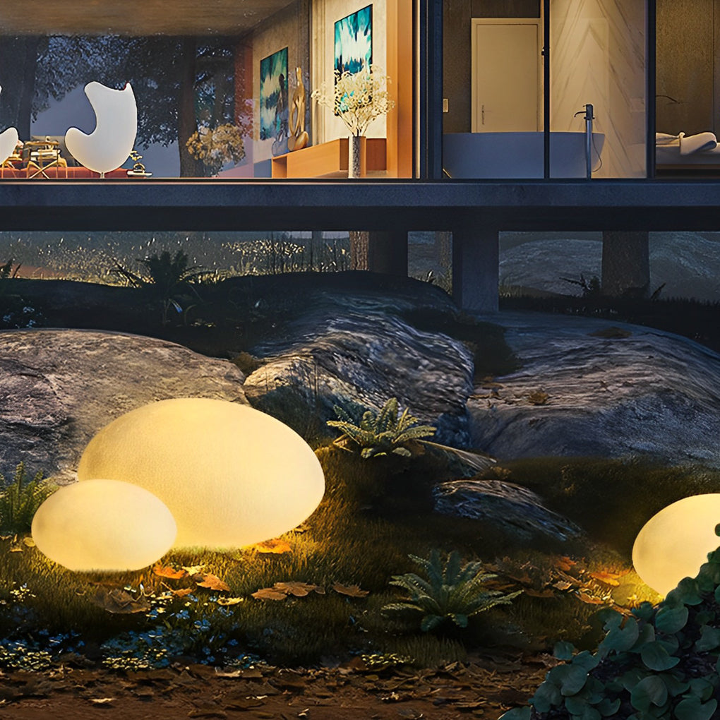 Pebble garden lights with close-up of the light source and diffusion.