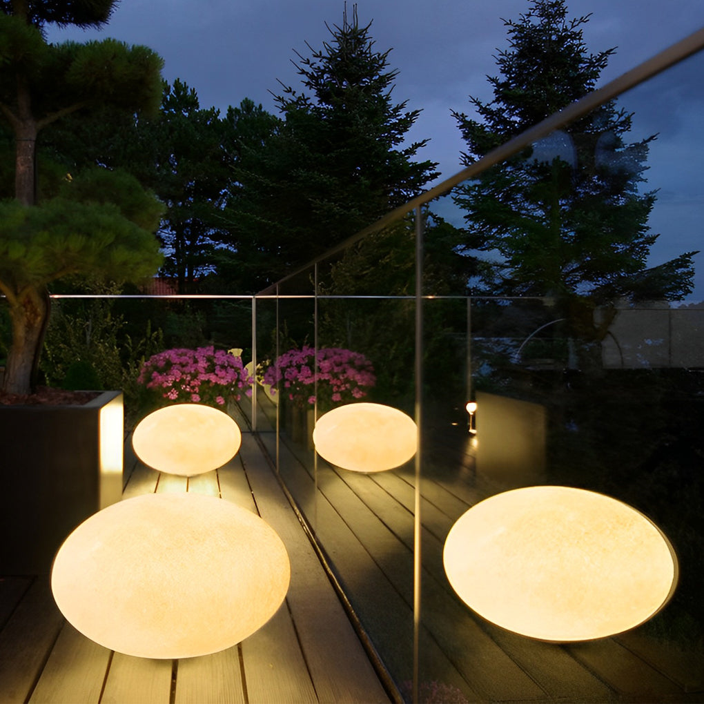 Pebble garden lights with side view showing depth and light diffusion.