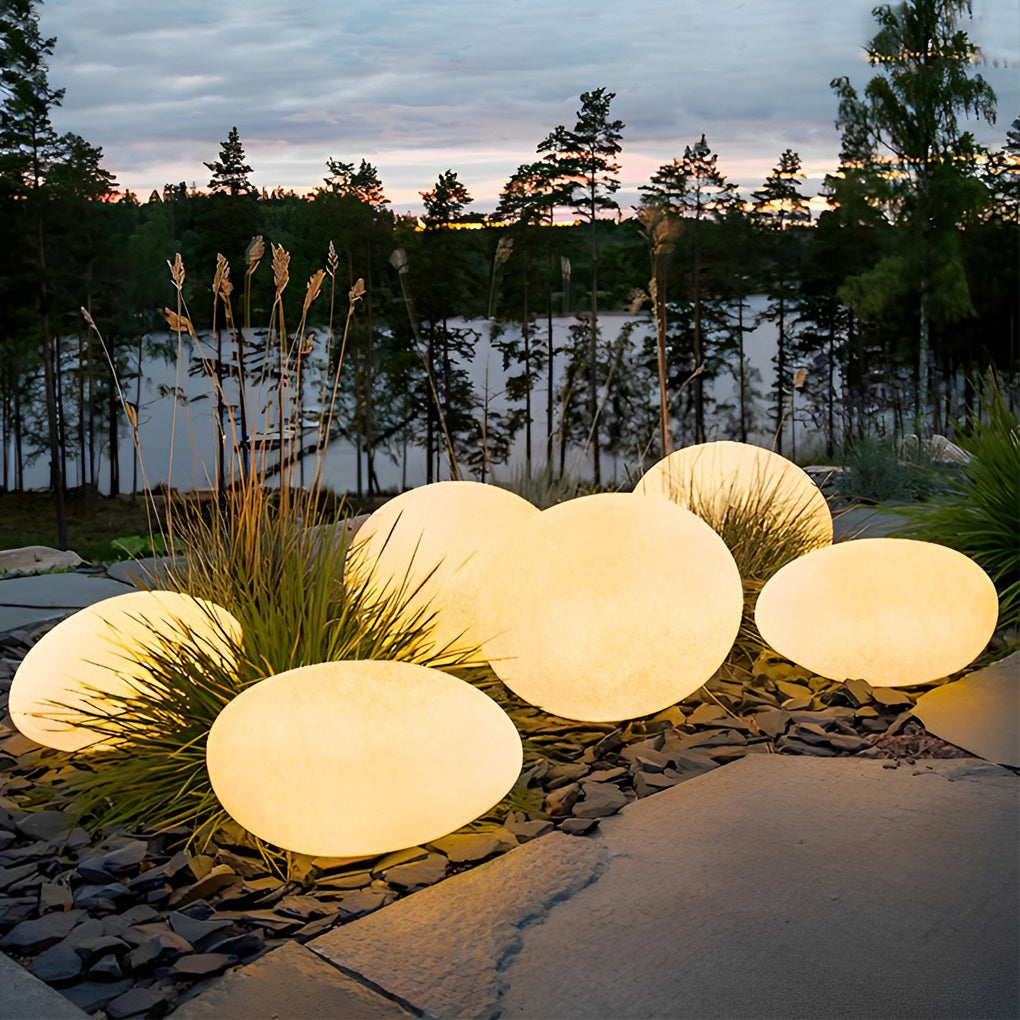 Pebble garden lights with top view highlighting the unique pebble shape.