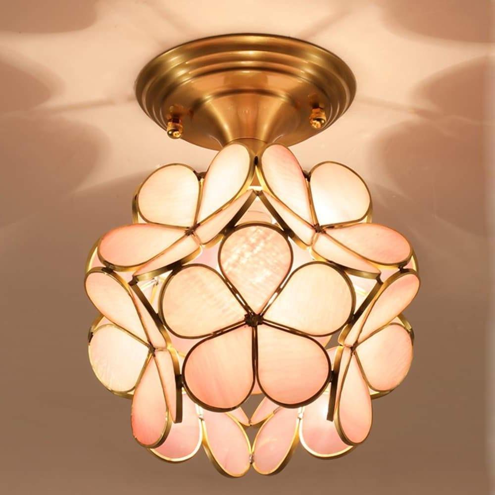Petal shaped ceiling lights in gold, close-up of the crystal petals.
