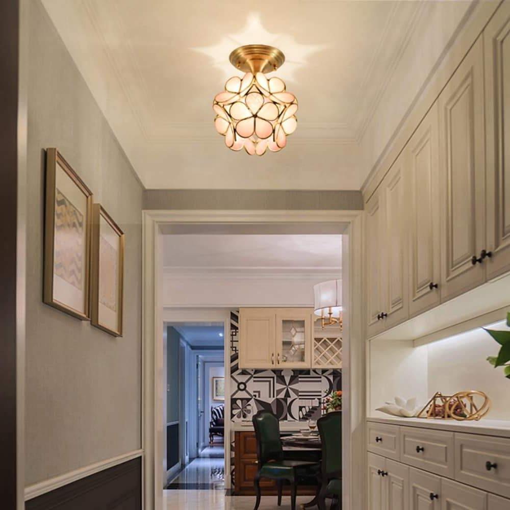 Petal shaped ceiling lights in gold, close-up of the petal details.