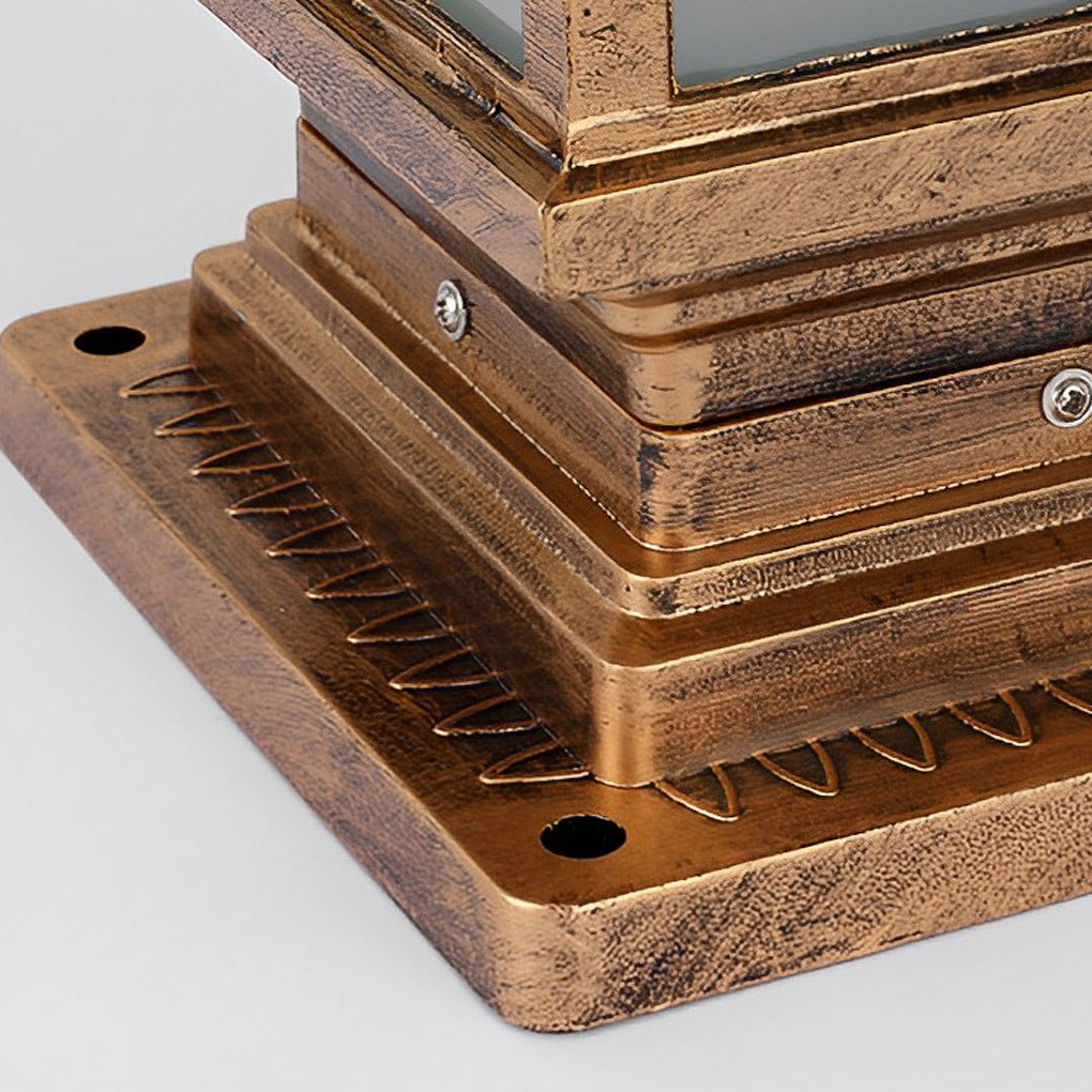 Pillar lantern lights with a close-up of their glass panels and intricate metalwork.