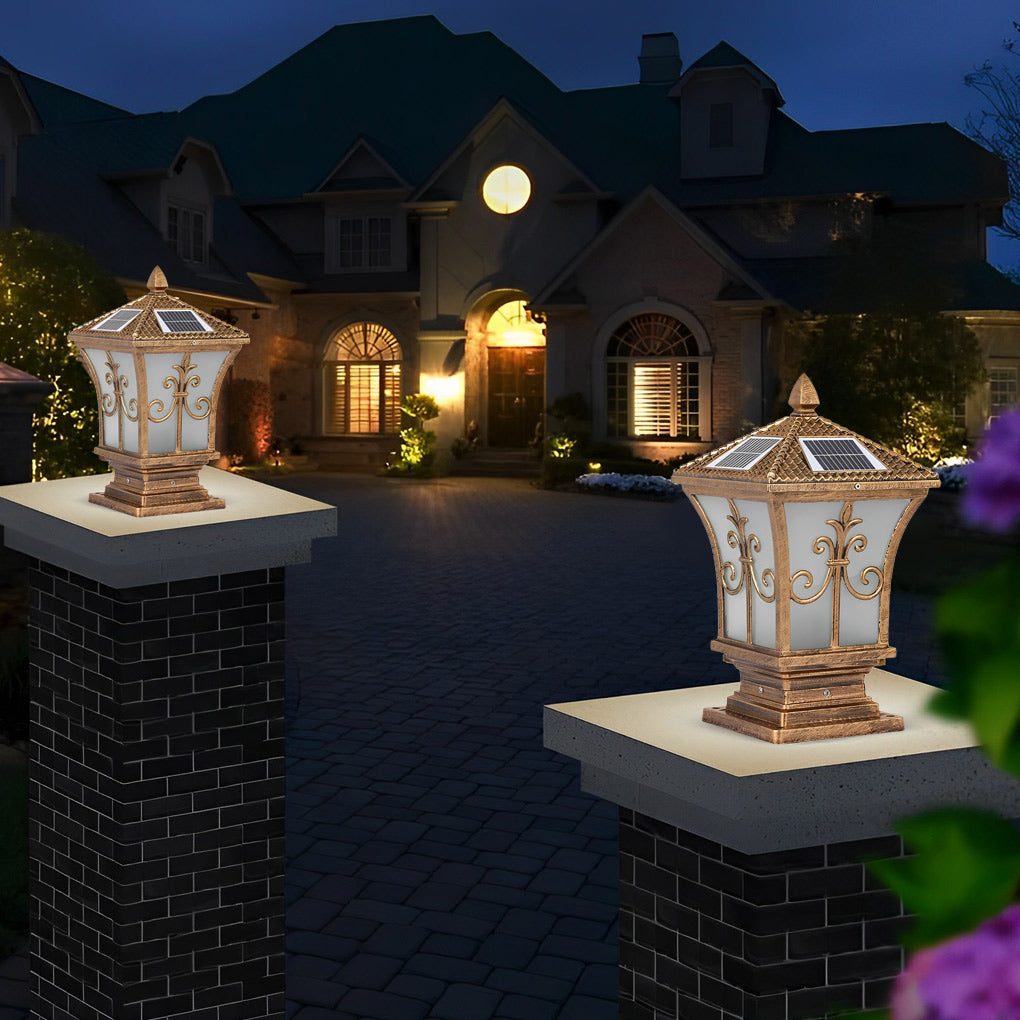 Pillar lantern lights with a decorative design, enhancing the ambiance of a front yard.