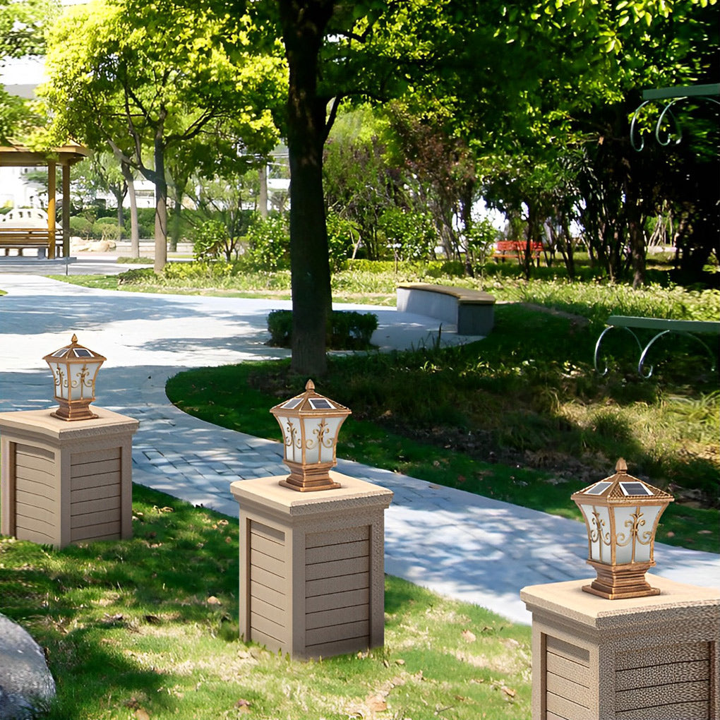 Pillar lantern lights with a traditional design, installed on a brick pillar.