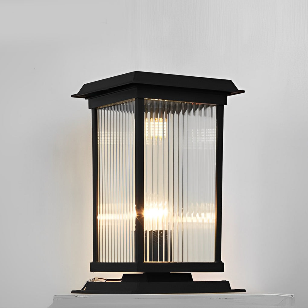 Pillar solar light studio shot with illuminated interior, emphasizing lantern-style frame and warm LED glow.