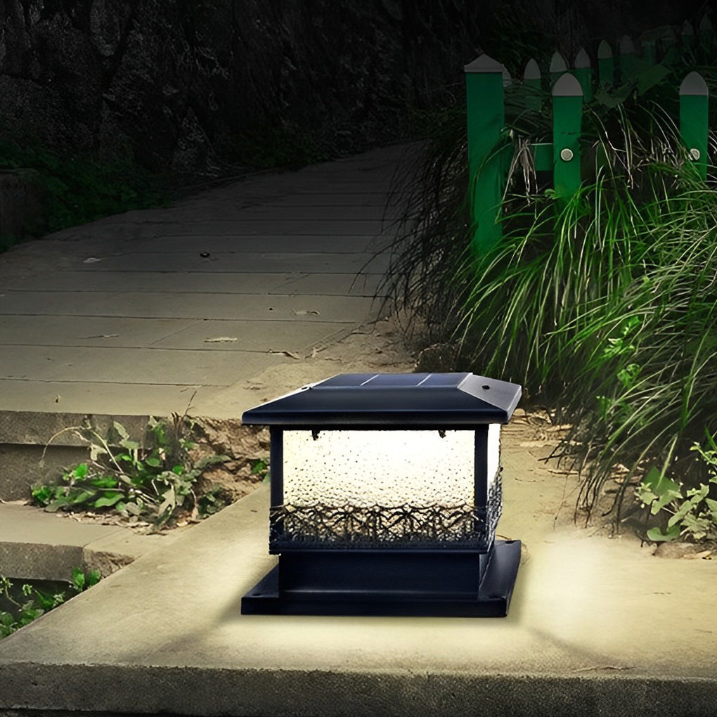 Pillar solar lights for outdoors placed beside a garden path, providing soft illumination and guiding footsteps at night.