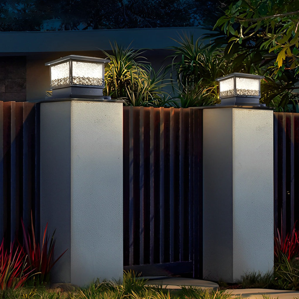Pillar solar lights for outdoors mounted on tall gate columns, providing balanced illumination and architectural accent lighting.