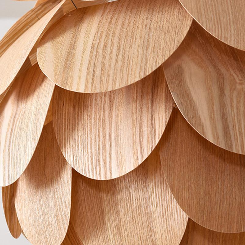 Pinecone pendant light with a layered design, mounted in a contemporary room.