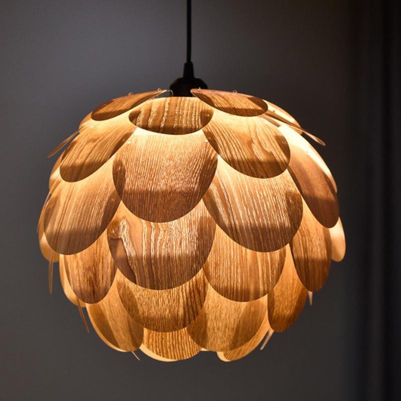 Pinecone pendant light with a layered design, providing warm illumination in a cozy room.