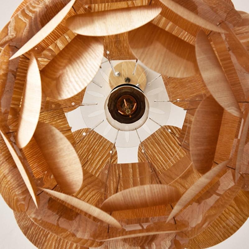 Pinecone pendant light with a natural finish, illuminating a stylish dining area.