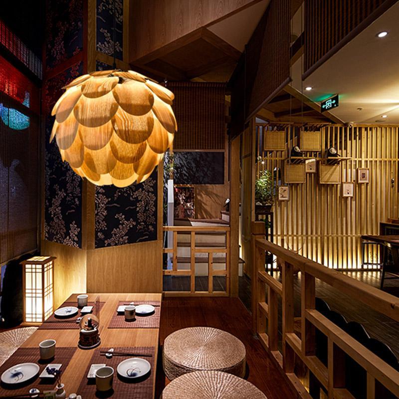 Pinecone pendant light with a natural finish, enhancing a stylish dining room.