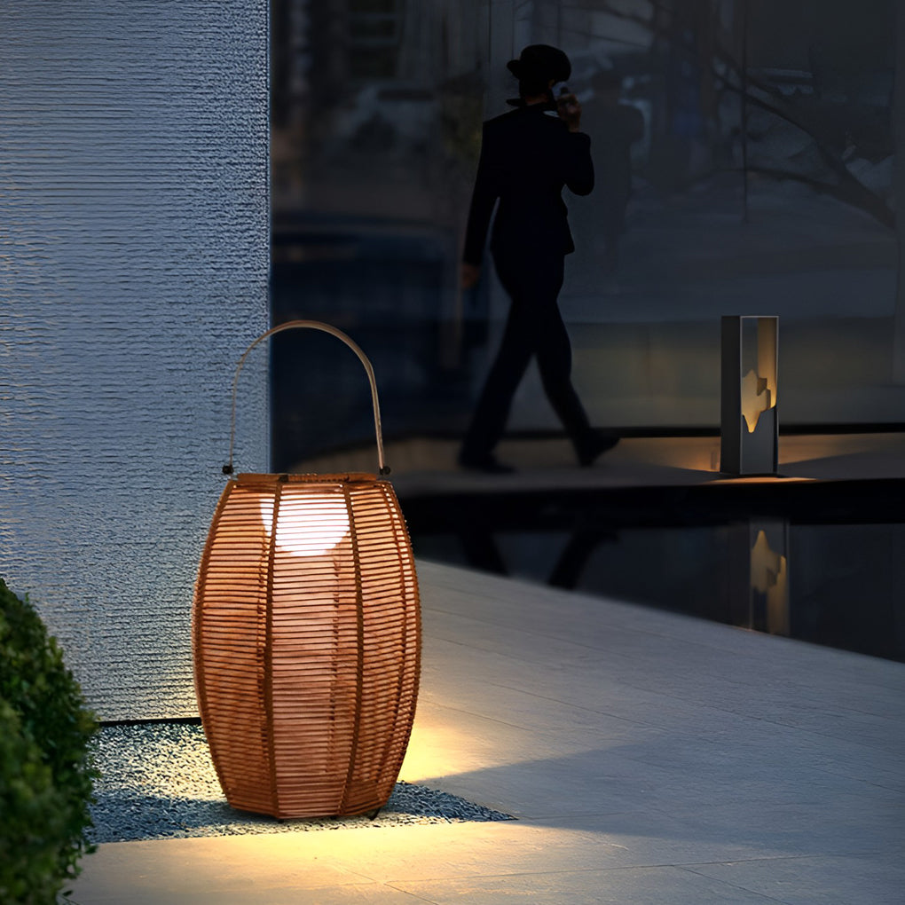Rattan floor lantern providing elegant illumination for a modern garden.