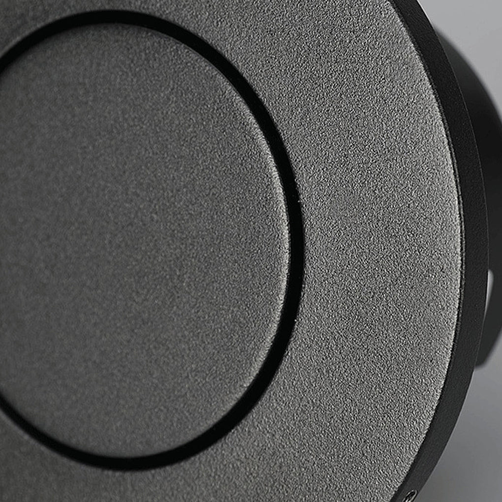 Close-up texture detail of matte black recessed led reading lamp trim.