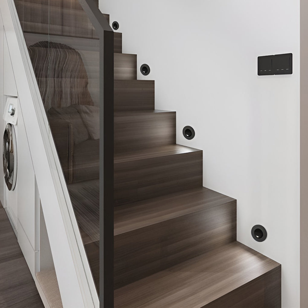 Staircase wall fitted with recessed led reading lamp style accent lighting.