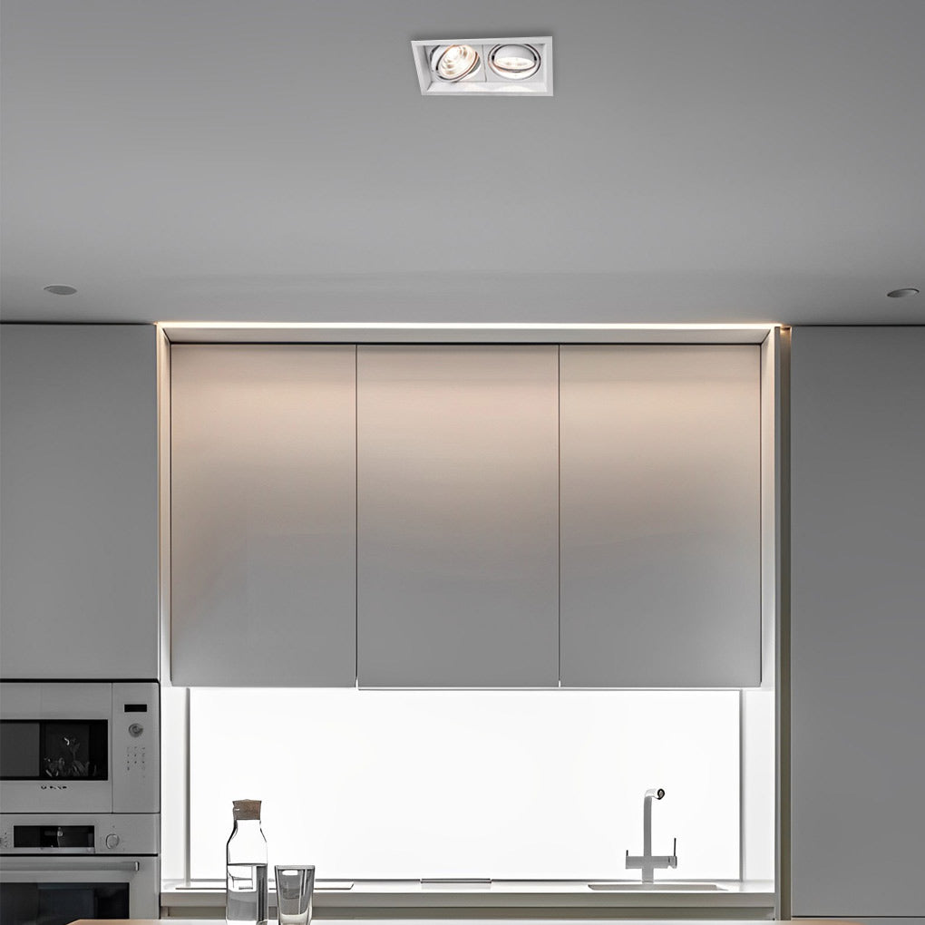 Recessed twin ceiling light installed above kitchen sink in minimalist interior.