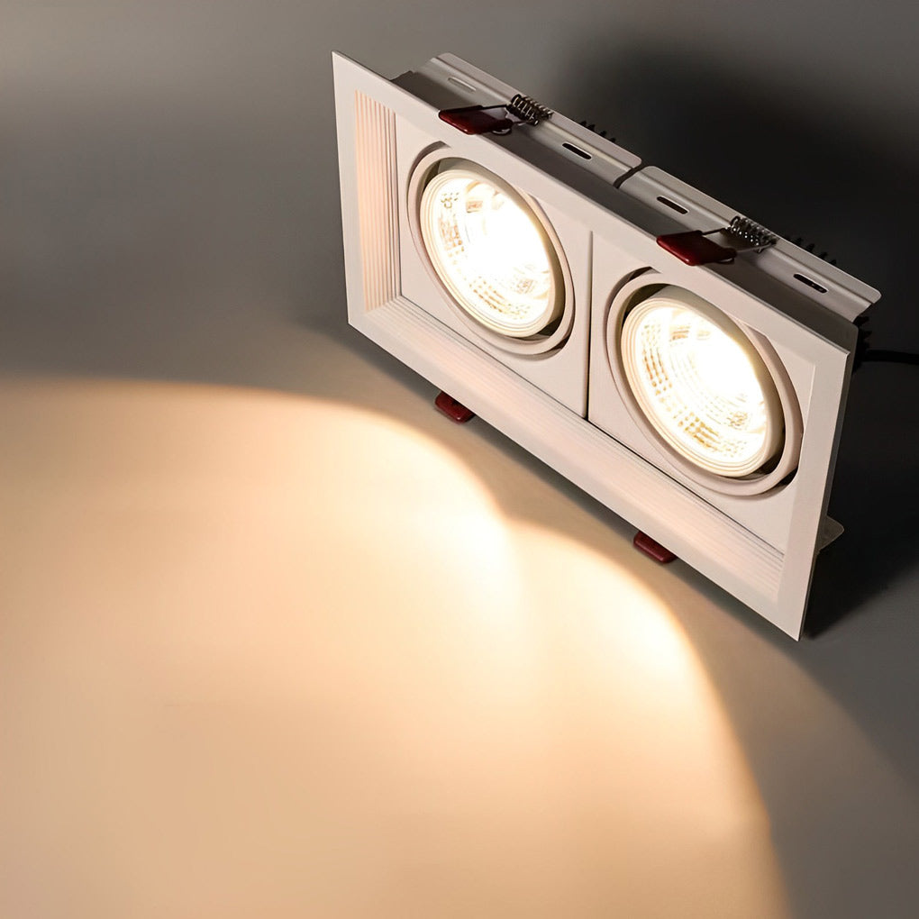 Close-up of rectangular twin ceiling spotlight casting soft directional light.