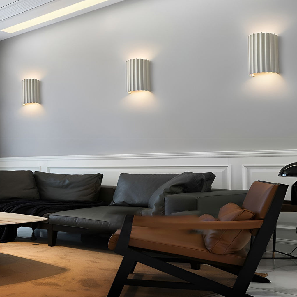 Ribbed wall sconces with close-up of its textured design and light output.