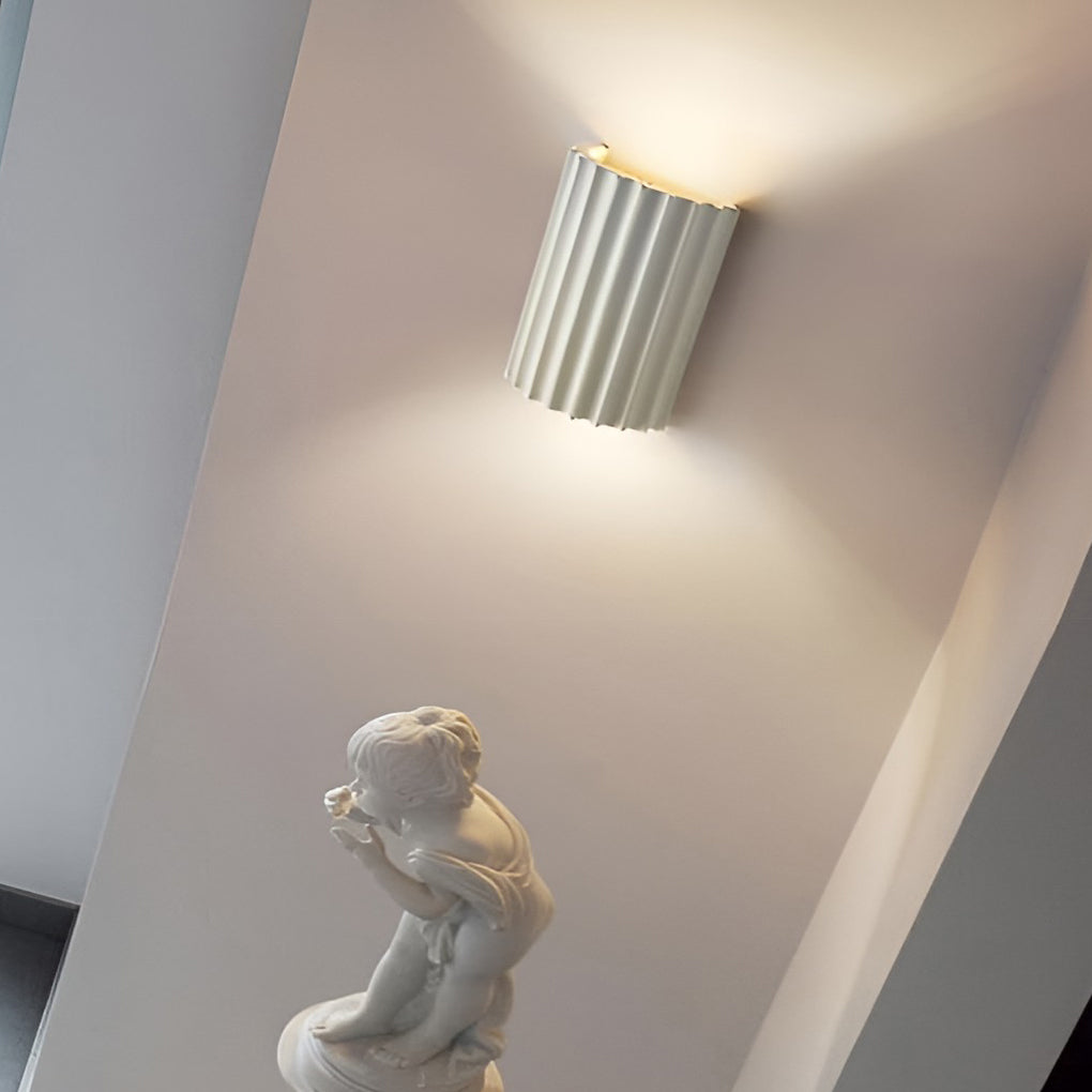 Ribbed wall sconces with detailed view of its green ribbed structure.