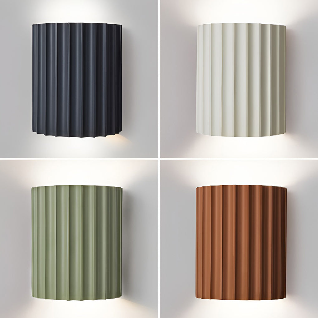 Ribbed wall sconces with side view showing depth and light diffusion.