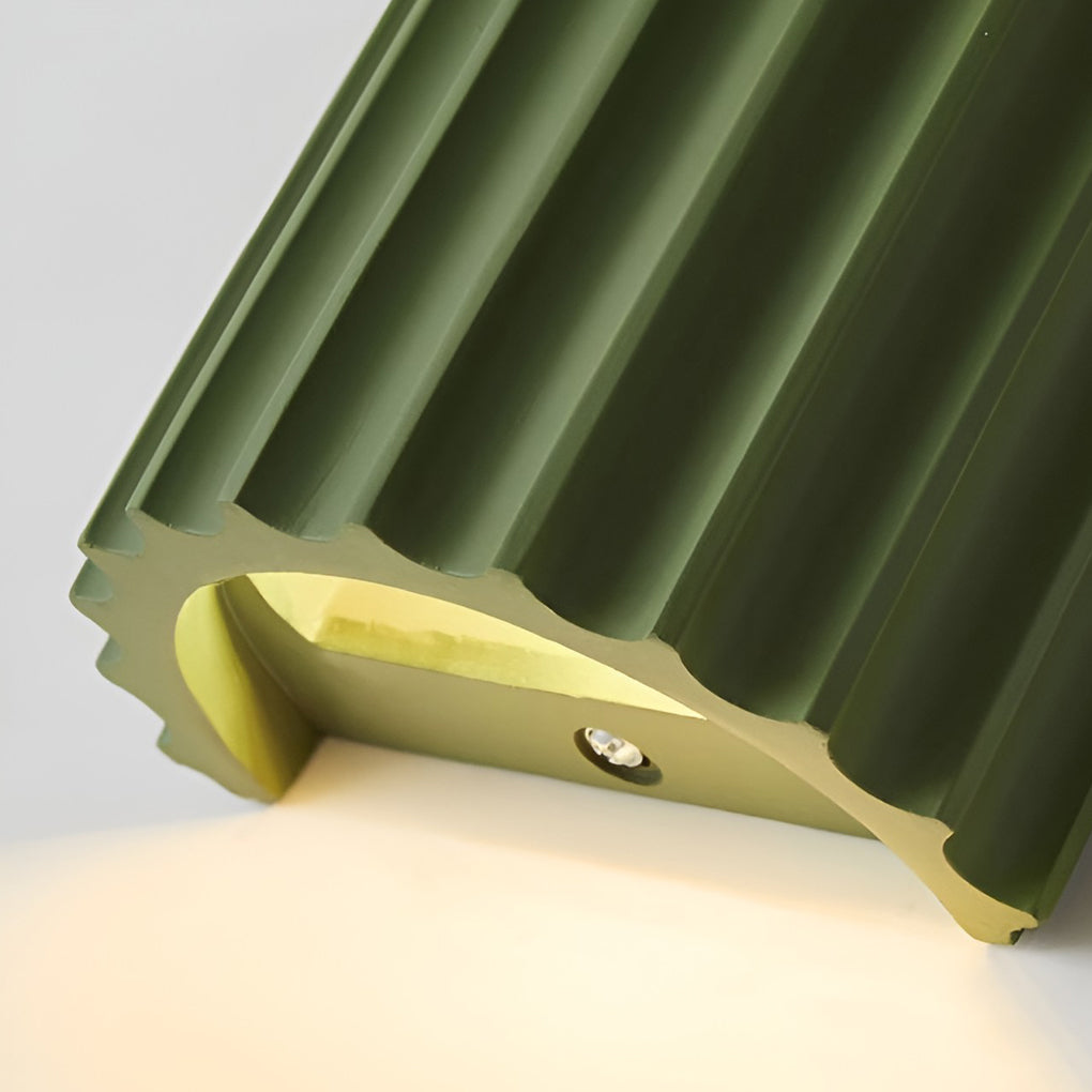 Ribbed wall sconces with top view highlighting unique ribbed design.