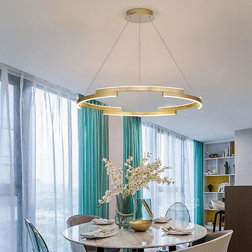 Ring chandelier brass illuminating a modern living space with elegant light.