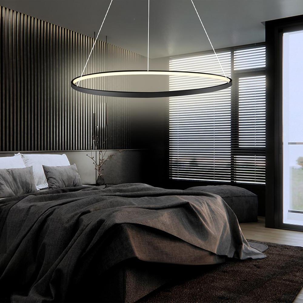 Ring chandelier LED above a modern bed setting, blending clean lines and warm light to create a calm and relaxing bedroom environment.
