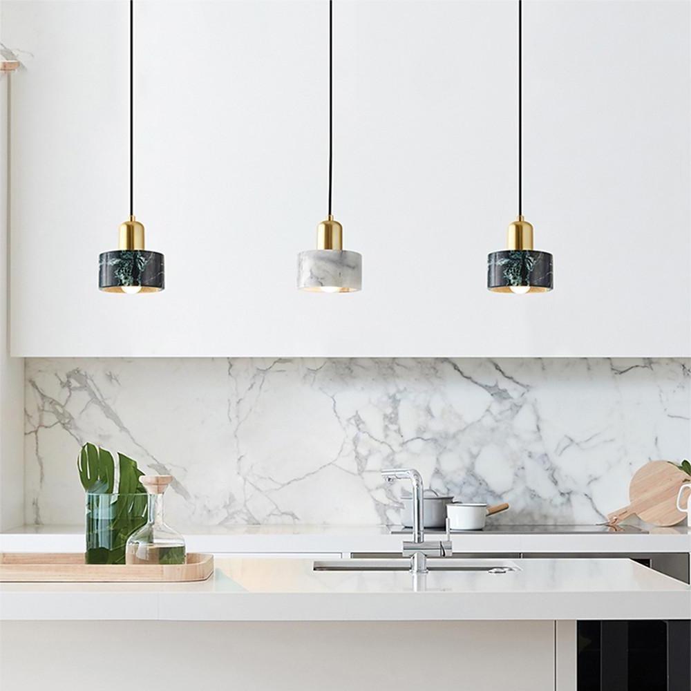 white and black marble look ceramic pendant lights over a kitchen island