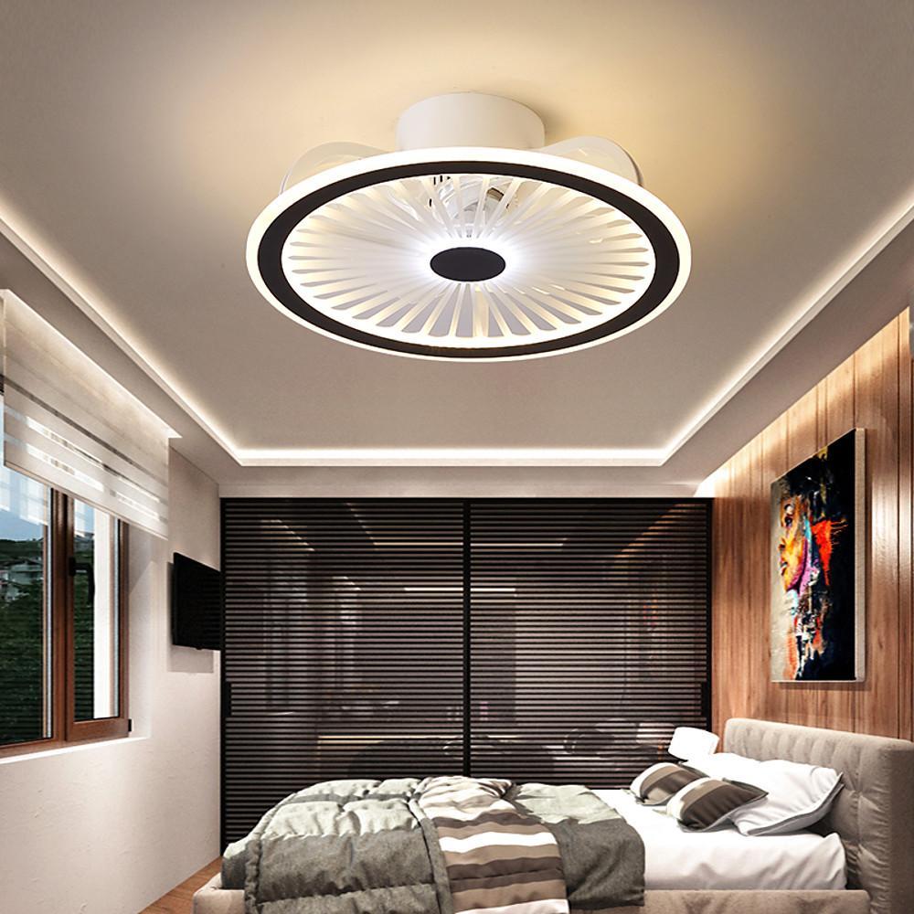 Round ceiling fan with LED light in modern bedroom with cove lighting.