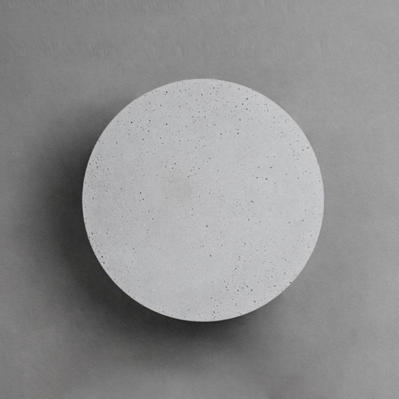 Close-up of round exterior wall lights showcasing their modern and sleek design.