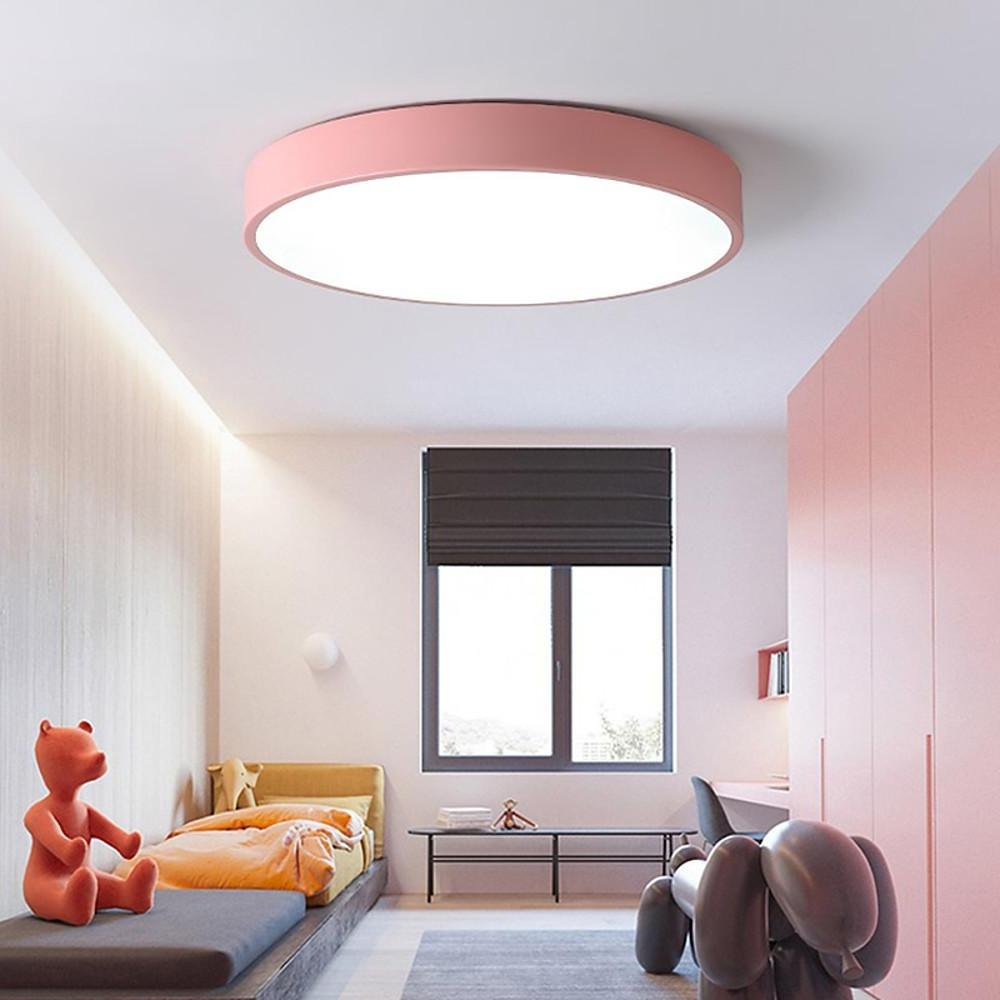Pink round led ceiling lights creating a playful and soft lighting effect in a kids room.