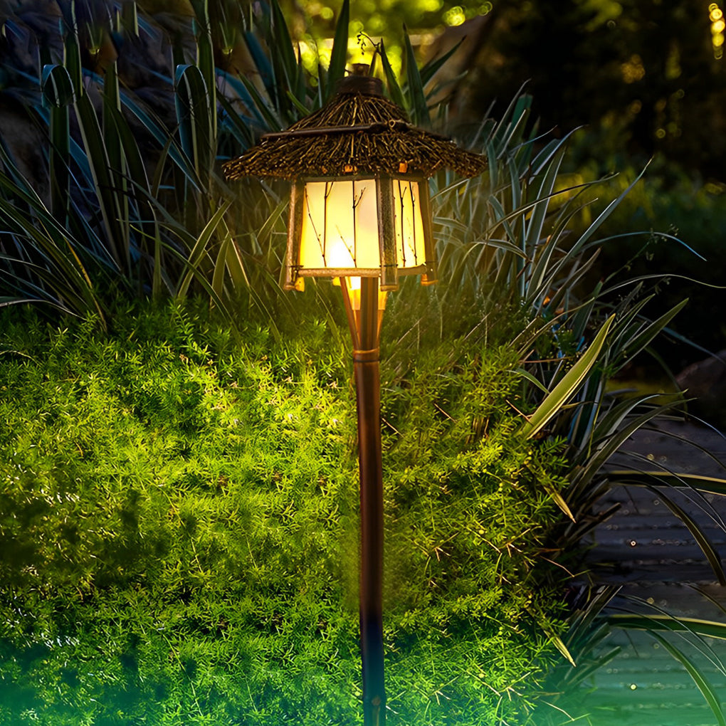 Rustic pendant light enhancing a garden pathway with natural, earthy design.