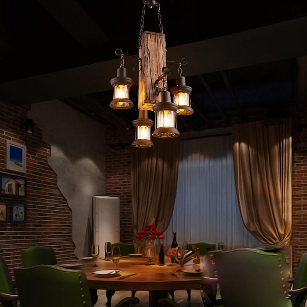 Rustic wood chandelier enhancing a cozy dining area with vintage, industrial design.