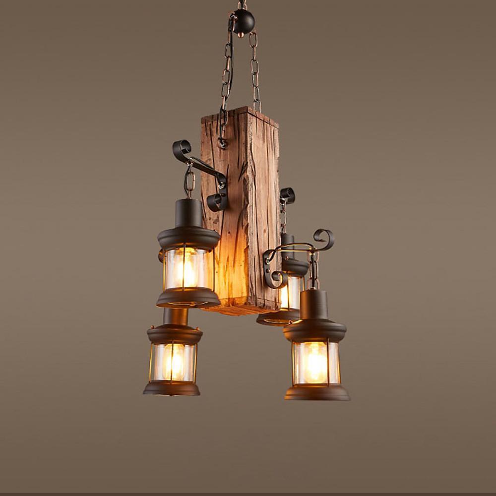 Farmhouse rustic wood chandelier with metal arms and glass lantern shades on neutral background.