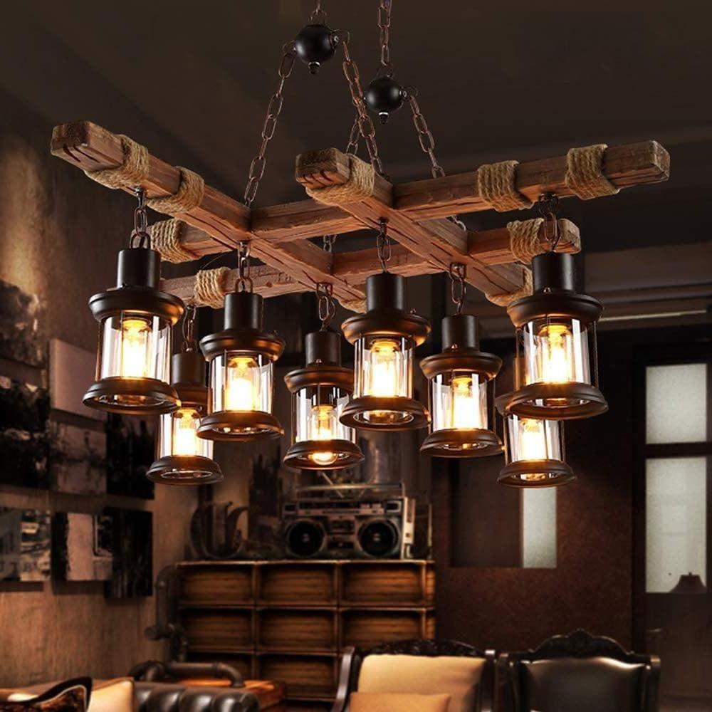 Close-up of rustic wood chandelier with rope-wrapped beam and metal chain suspension.