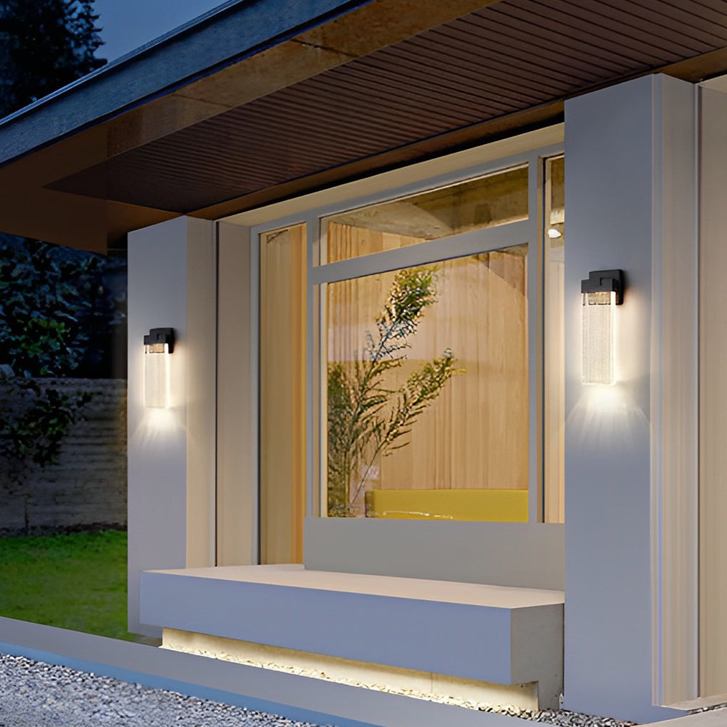 Seeded glass outdoor wall lighting providing soft illumination near a dining area.