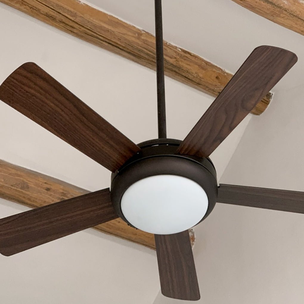 Semi-flush mount ceiling fan with light, showcasing the wooden blades and light.