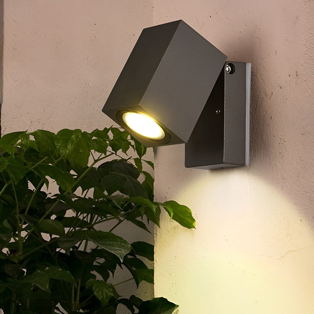 Outdoor sensor wall lights in black, installed near a modern house entrance.