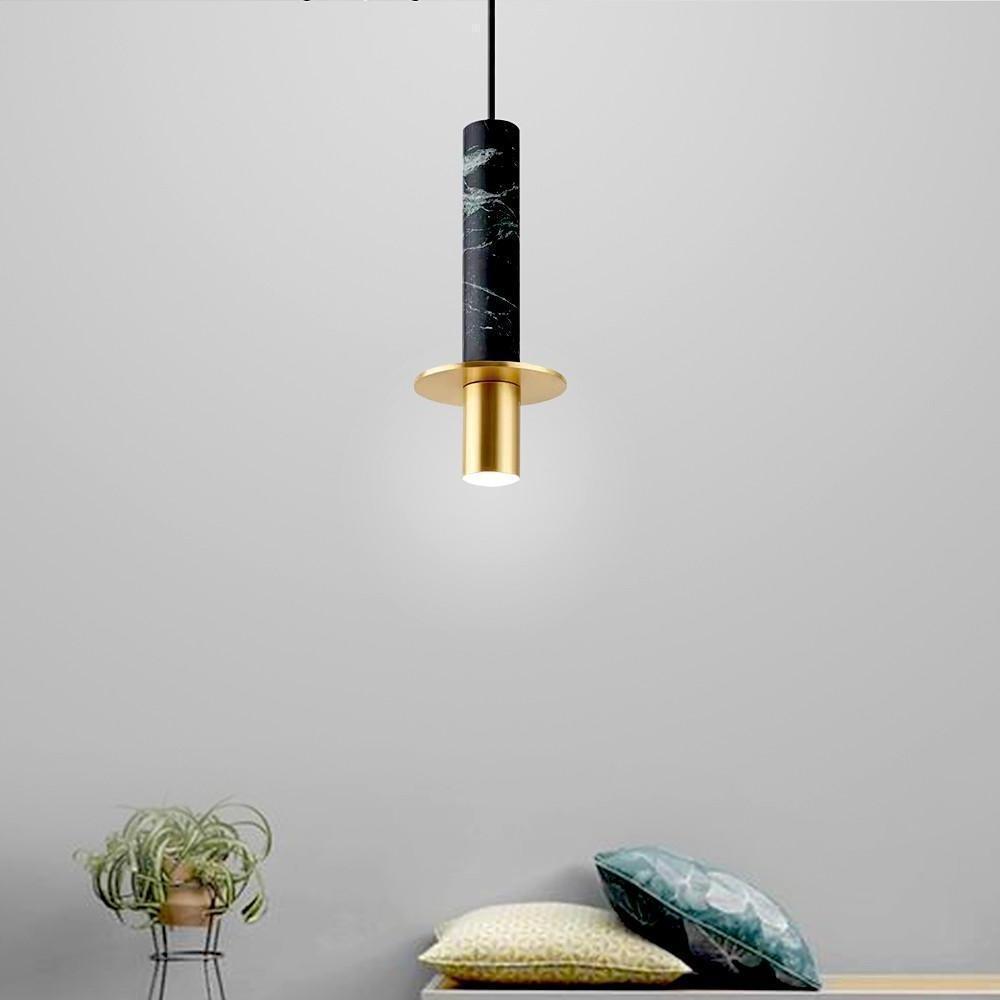 Modern single black marble alabaster mini pendant lights in a minimalist grey living room nook.