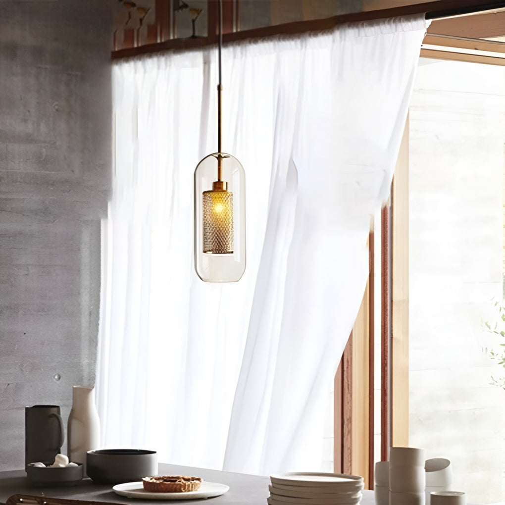 Single capsule Clear Glass Globe Pendant with a gold mesh interior over a sunny dining area.