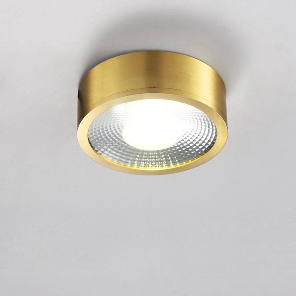 Single gold LED downlight installed on a white ceiling surface.
