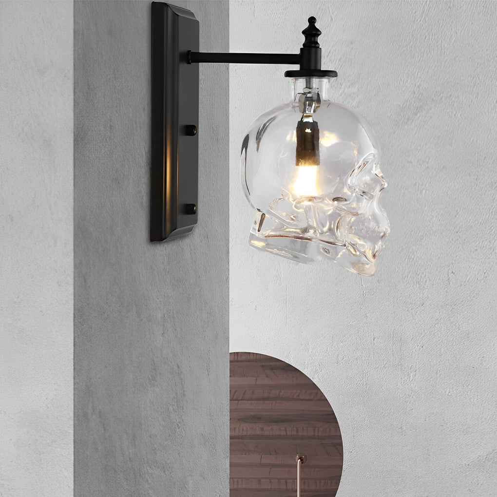 Sleek glass lamp shades for wall lights with skull design, mounted on a gray wall, providing focused illumination.